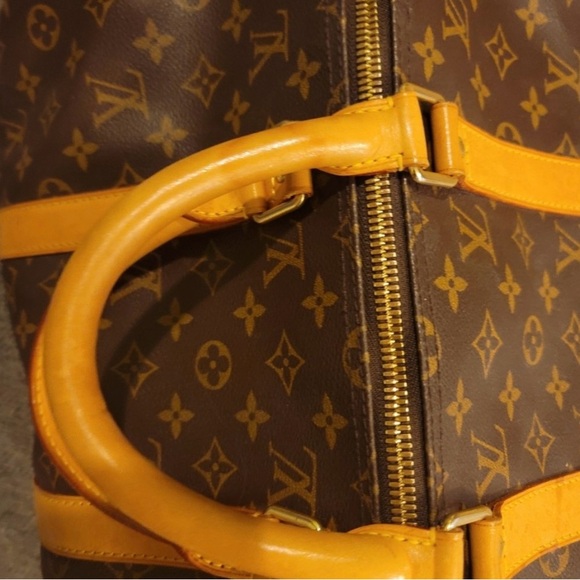 I’m selling a brown and tan Louis Vuitton travel bag. - Picture 5 of 7
